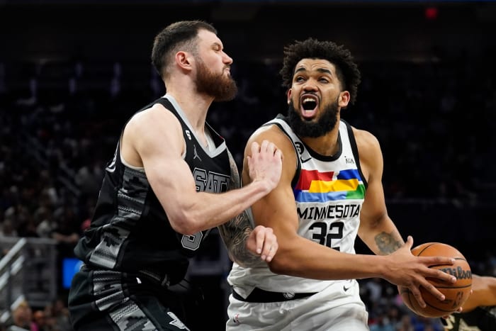 San Antonio Spurs center Sandro Mamukelashvili defending Minnesota Timberwolves forward Karl-Anthony Towns.
